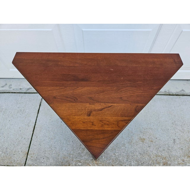 This great looking Arts & Crafts or Mission style triangle shaped side table features a cherry top and black lacquered...