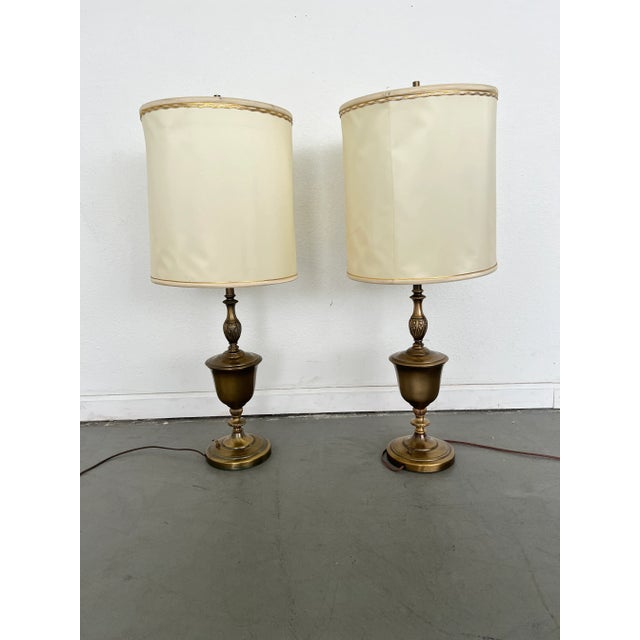 Add timeless elegance to your space with this stunning pair of Rembrandt-style vintage brass torchiere table lamps, from...