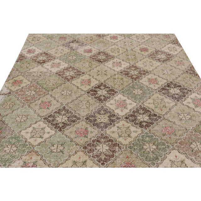 This vintage rug is a 7x10 Turkish distressed piece, made with hand-knotted wool circa mid-20th century. It is an exciting...
