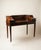 1920's "Carlton" Flame Mahogany Edwardian Writing Desk with Original Patina on Brass Casters. Brass hardware throughout....