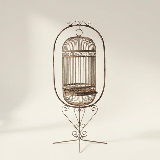 Transport your space to a classic French garden with this stunning antique iron birdcage. Standing at an impressive 62...