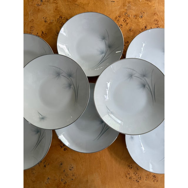 A beautiful set of eight Hutschenreuther Caribe soup bowls featuring a clean, minimalist design accented with soft blue-...