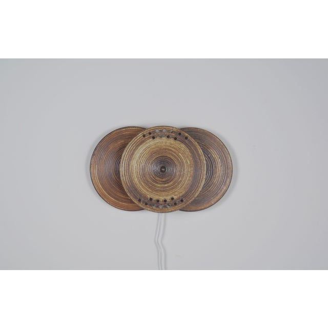 Danish ceramic wall lamp from the 1970s with model number 1103. It was manufactured by the ceramics company Axella...