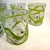 A vibrant 5‑piece set of hand‑blown tumblers from Peàn Doubulyu’s expressive Wavie line — studio glass created by partners...