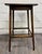 This is a beautiful antique Arts & Crafts / Mission-style oak side table featuring a classic rectilinear design, richly...