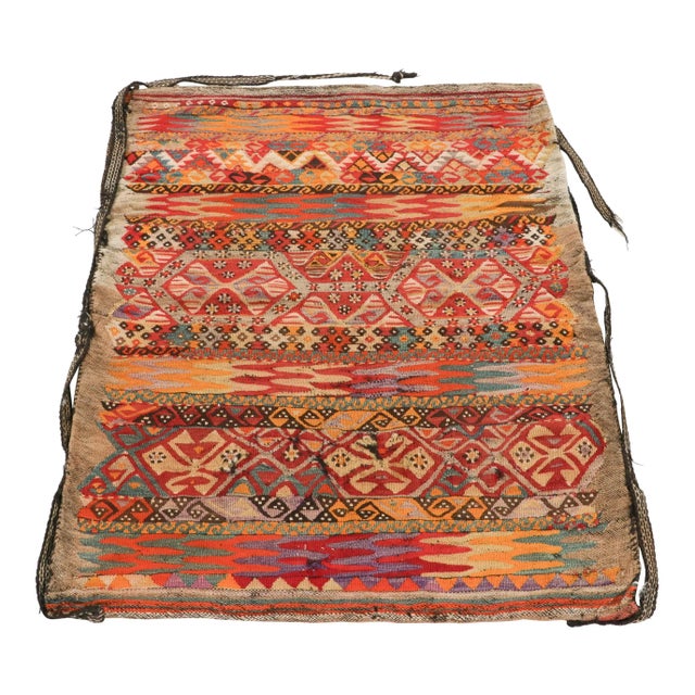 Handwoven in a wool flatweave originating from Turkey circa 1920-1930, this 3x4 antique bag textile is an exciting...