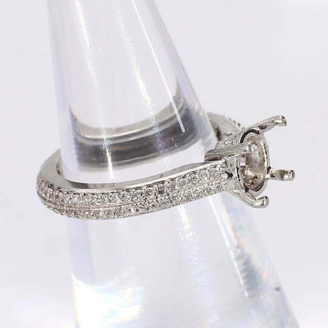 Center Mounting Holds a 6.5mm Round Stone, Roughly Equal to a 1ct Round Brilliant Diamond. And a pavé diamond band. Ring...