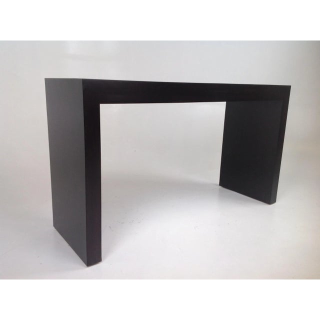 Custom made console done in a espresso finish. The console has clean lines. The dims are 34" tall 5' long and 20" deep....