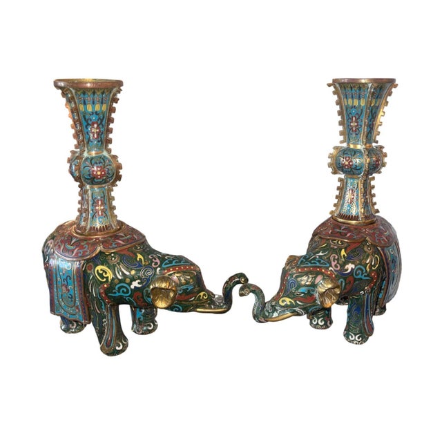 Fine pair of 19th century Chinese cloisonné enamel elephant vases, each modeled as a richly caparisoned elephant standing...