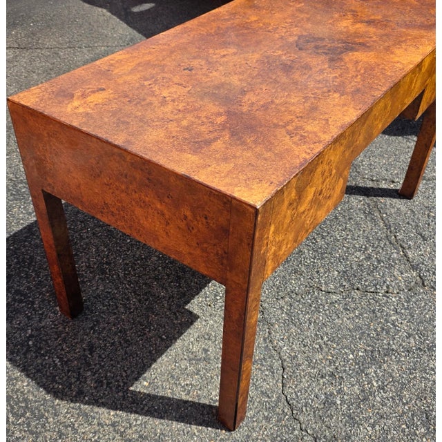 This Vintage Burlwood Campaign-Style Writing Desk has a minimalist profile and is elegant, timeless, and sophisticated...