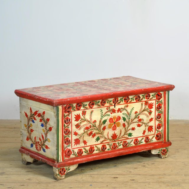This vintage pine chest from the mid-20th century is a real eye-catcher. It is richly decorated with hand-painted...