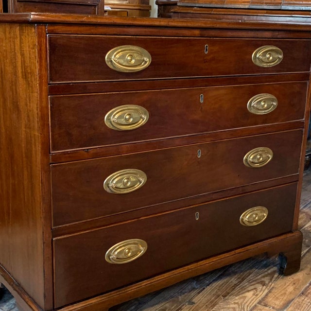 A diminutive and versatile English mahogany chest of drawers, ca. 1800 / early 19th century, of a size that would be ideal...