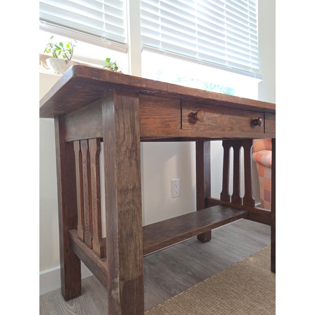 This is an authentic early 20th century Arts and Crafts Mission oak library desk. It features the clean geometry and...