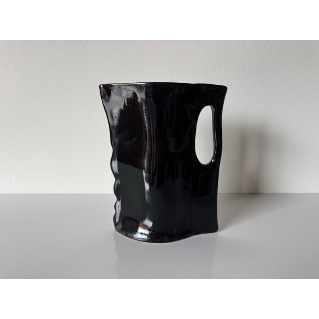 Striking sculptural art ceramic vase dated 2001 and signed JES on the underside. This bold piece features an expressive,...