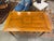 This vintage English game table with a rectangular top showcases a beautiful, tight oak grain structure finished in a...