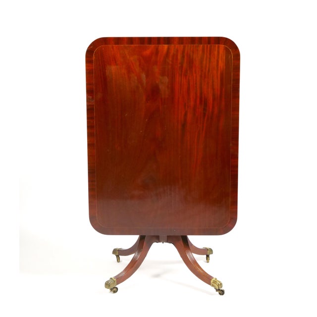 Transform your living space with this stunning 19th Century English George III Inlay Top Mahogany Wood Breakfast Table, a...