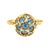 Vintage 18K yellow gold ring featuring and orb set with a cluster of blue zircons in star motif designs, supported by a...