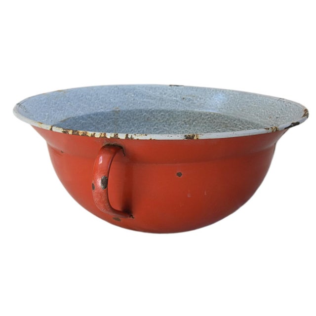 Vintage red enameled double-handled bowl. Maker's mark on the underside. Good condition; wear consistent with age and use;...