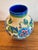 This vibrant Art Deco crackle-glazed ceramic vase features a bold floral pattern designed by Charles Catteau for Boch...