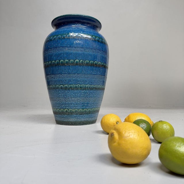 Large sculptural floor vase in a deep turquoise-blue glaze, executed in the distinctive Rimini Blu spirit associated with...