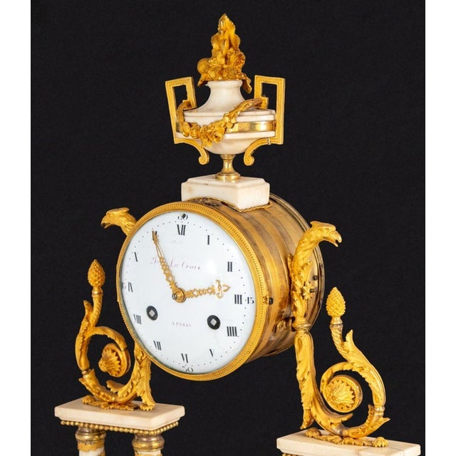Louis XVI Style Ormolu Mounted White Marble Mantle Clock, 19th century, the circular white enamel barrel dial signed...