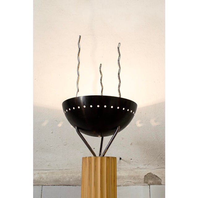 Halogen floor lamp with carved wooden frame, metal shade, and base. For Abitare il Tempo Designer Ugo La Pietra...