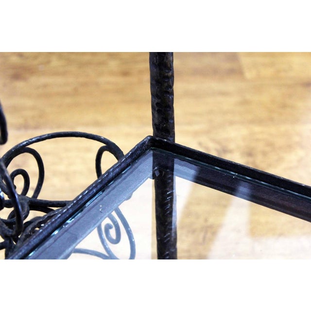 1950 iron and glass sideboard on castors As a piece of furniture for the living room or for serving a meal to friends,...