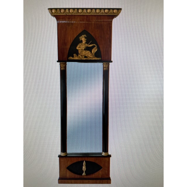 Mahogany Biedermeier-style pier mirror Molded cornice at top with gilt egg and dart pattern Ebonized Roman Corinthian...