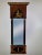 Mahogany Biedermeier-style pier mirror Molded cornice at top with gilt egg and dart pattern Ebonized Roman Corinthian...