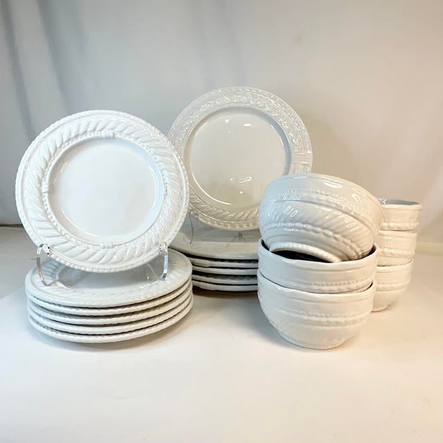 We love the boho chic shop Anthropologie and this set of dinnerware has the shop’s original sticker and does not appear to...
