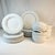 We love the boho chic shop Anthropologie and this set of dinnerware has the shop’s original sticker and does not appear to...
