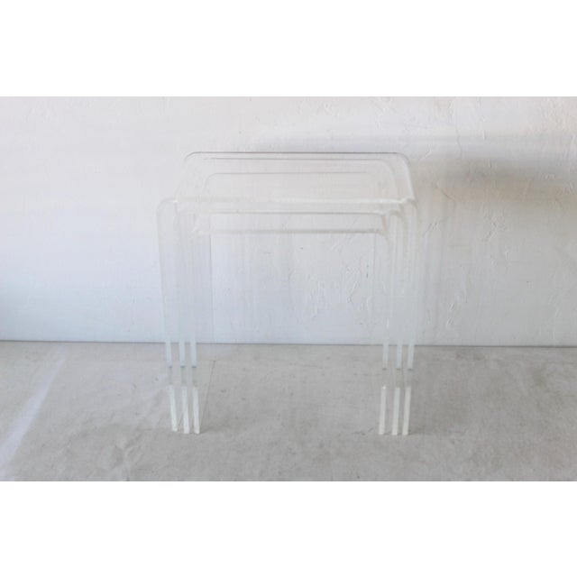 Vintage Modern Lucite Acrylic Waterfall Nesting Tables-set of 3, in good vintage condition with some light scratches to...