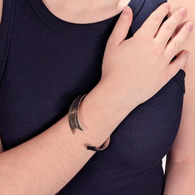 A fine Old Pawn or Navajo cuff bracelet. In the form of a curved arrow. Unmarked for silver fineness. Likely sterling....