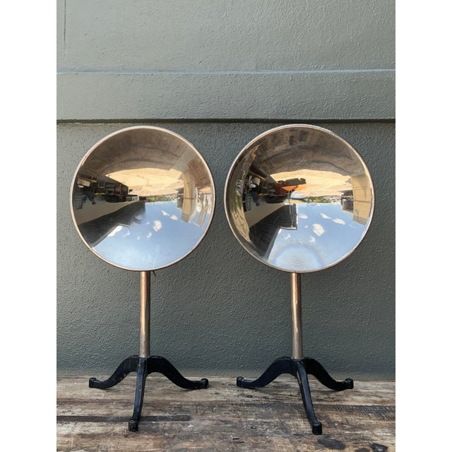 This striking pair of vintage industrial reflectors epitomizes the sleek utilitarianism of the Machine Age. Featuring...