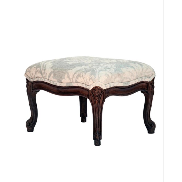 Delicately hand carved antique French footstool newly upholstered in a fine Italian damask in linen & wool. Expertly...