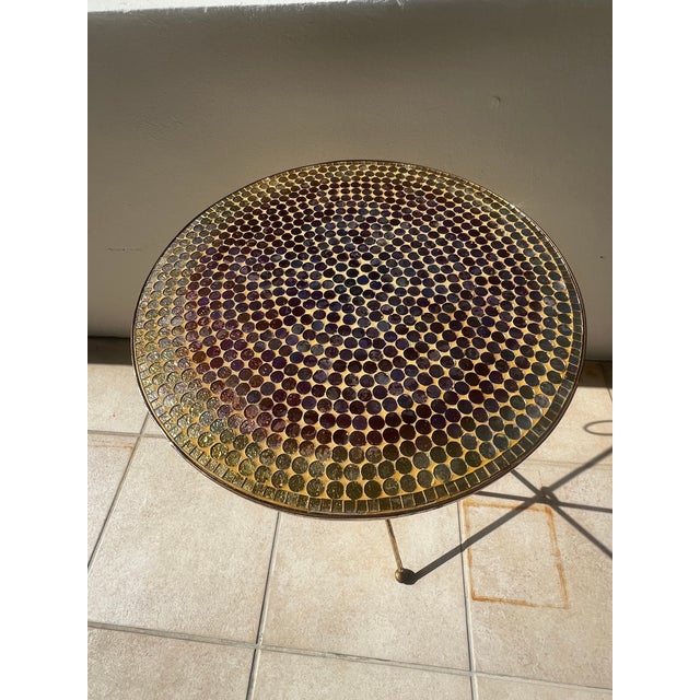 A striking 1960s Italian folding drinks table featuring a hand-laid glass mosaic top in shimmering jewel-like tones of...
