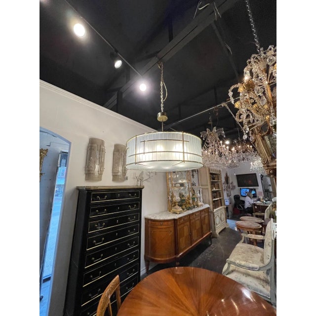 Beautiful modern large scale Murano glass and brass round chandelier. Creates a very sleek look! Exquisite!