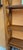 Elegant freestanding bookcase in solid cherry wood. It features a rustic style with cross-shaped sides. Open structure...