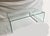 Incredible classic bent glass coffee table with a simple design. Table consists of one large sheet of tempered glass,...