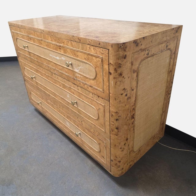 Made Goods Beaumont 48” Dresser featuring a mappa burl wood top, raffia-wrapped drawer fronts, gold-tone hardware, and...