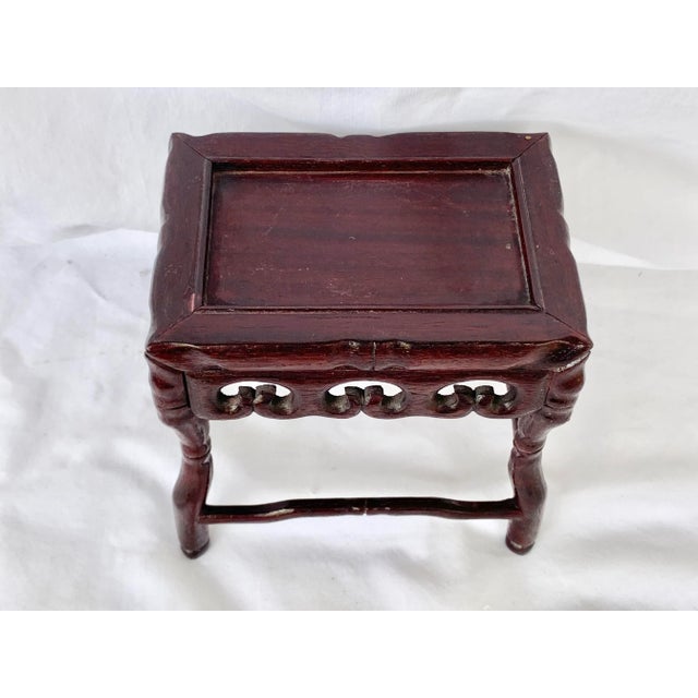 Wonderful vintage rosewood stand. Small tabletop size that is perfect for a vase or small plant. Intricate carved base and...