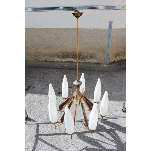 Large Wooden Murano Glass and Brass Chandelier from Esperia, 1950s, in Good conditions. Designed 1950 to 1959 This piece...