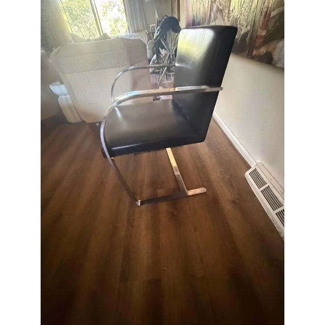 Quantity of 4 Knoll Brno Black Leather chairs. Chairs have manufacturing tag underneath the seats. Tag is Knoll...