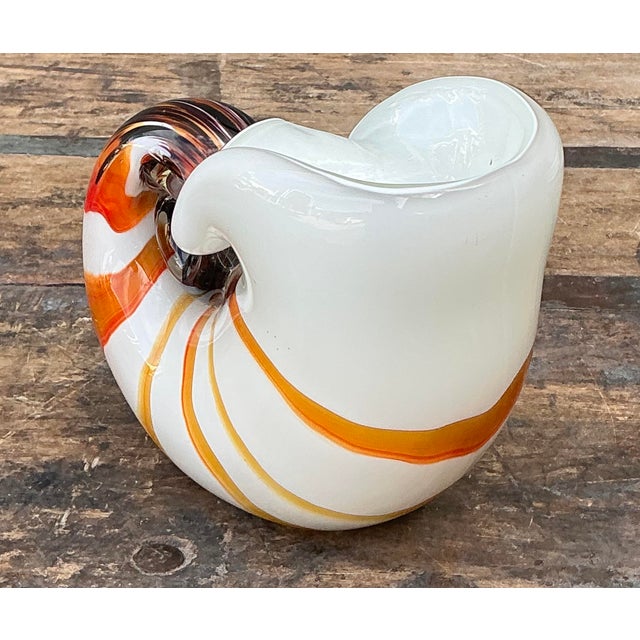 This exquisite vintage Murano glass nautilus shell is a stunning example of mid-century Italian artistry. Hand-blown on...