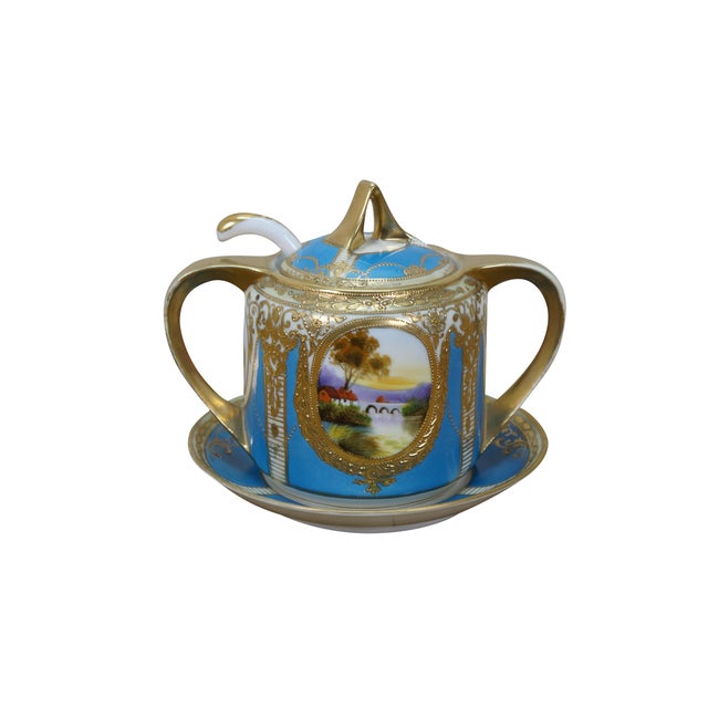 Early to mid 20th century Noritake porcelain sugar bowl with lid, spoon and underplate. Imitates the look of French Sevre...