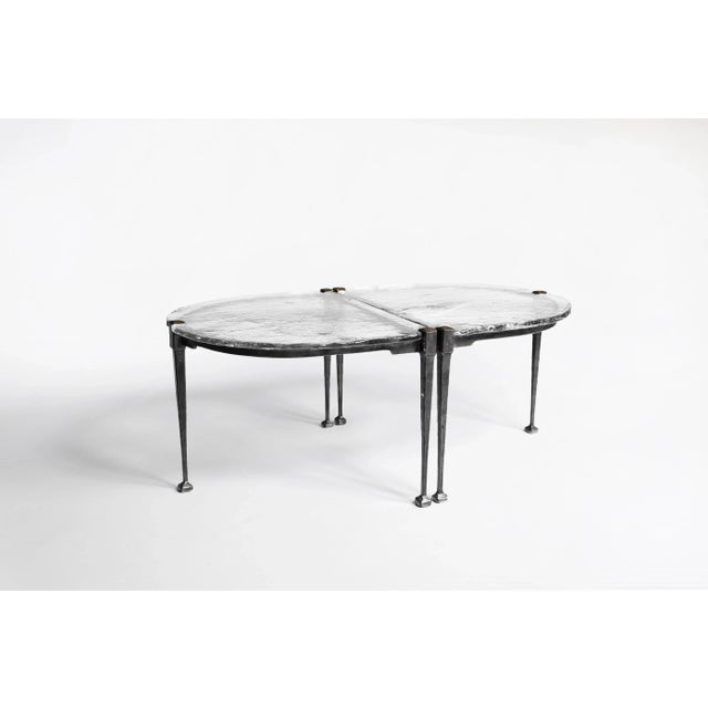 This collectible set of two Brutalist industrial tables by Lothar Klute, crafted in 1990s Germany, features forged bronze...