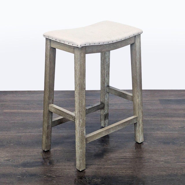 Upholstered stool with nailhead trim Brand Pottery Barn Dimensions 16.3ʺW x 10.5ʺD x 24.5ʺH Seat Height 24 Item ID 1068101...