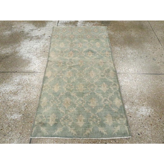 A vintage Turkish Anatolian throw rug handmade during the Mid-20th century. Measures: 2' 7" x 5' 2"
