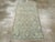 A vintage Turkish Anatolian throw rug handmade during the Mid-20th century. Measures: 2' 7" x 5' 2"