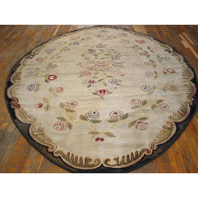 Antique American hooked rug, measures: 9'0" x 12'0".